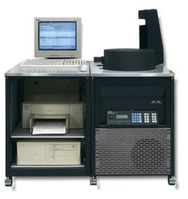 Bench-top laboratory analyzer with built-in computer, printer, and control keypad.