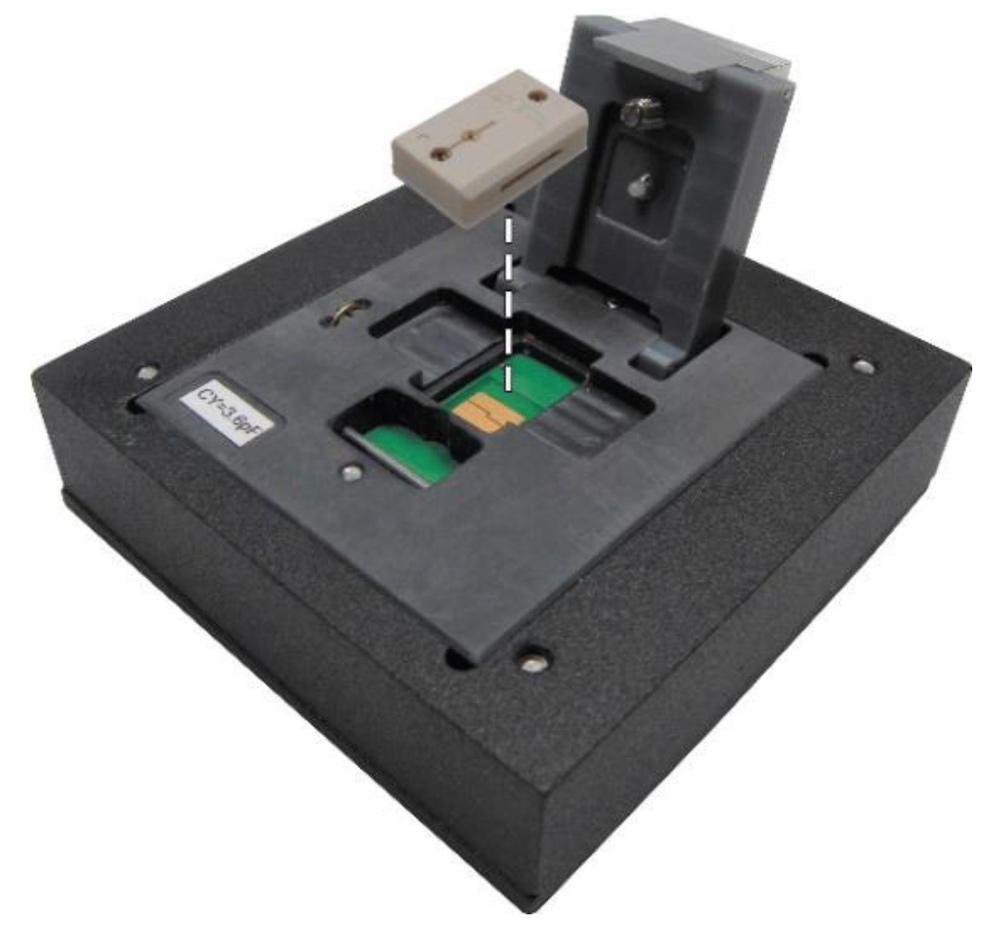 Black card reader/base with a sliding slot; beige connector raised above the slot for card insertion (data input device).